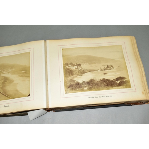 570 - TWO VICTORIAN/EDWARDIAN PHOTOGRAPH ALBUMS, leather bound with brass clasps, partially lithographed i... 