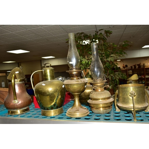 581 - BRASS AND COPPER METALWARES, etc, to include a twin handled cauldron with planished surface, two oil... 