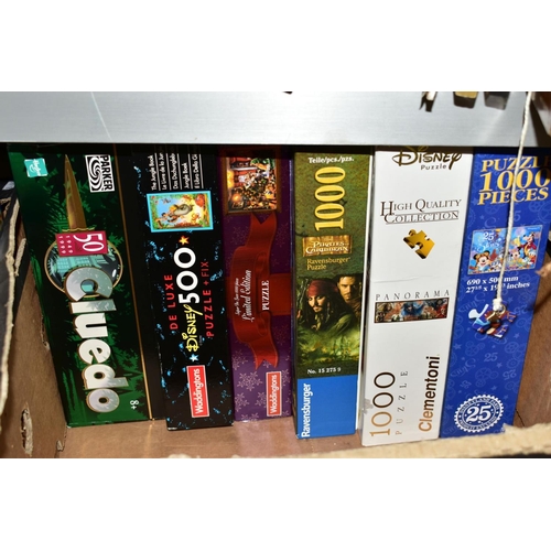 583 - TWO BOXES AND LOOSE BOARD GAMES AND JIGSAW PUZZLES, including 50th Anniversary Cluedo, Deluxe Scrabb... 