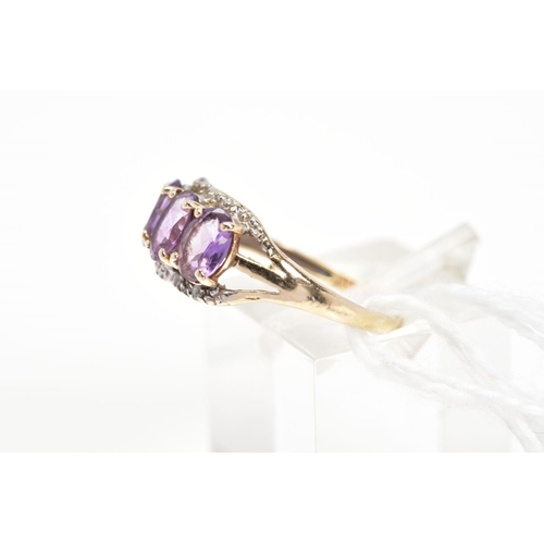 6 - AN AMETHYST AND DIAMOND RING, designed as three oval cut amethysts within claw settings with a singl... 