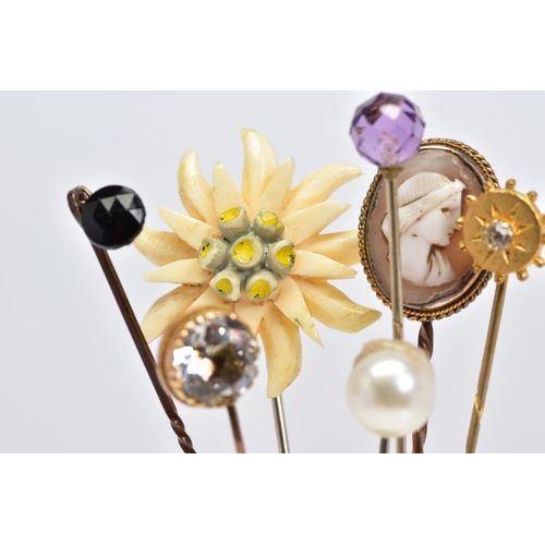 7 - A SELECTION OF SEVEN STICKPINS, to include one with a faceted spherical amethyst terminal, one with ... 