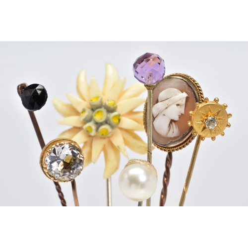 7 - A SELECTION OF SEVEN STICKPINS, to include one with a faceted spherical amethyst terminal, one with ... 