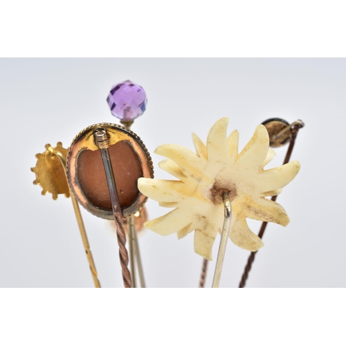 7 - A SELECTION OF SEVEN STICKPINS, to include one with a faceted spherical amethyst terminal, one with ... 