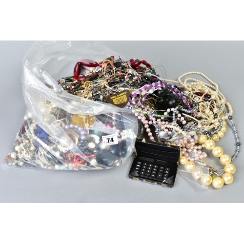 74 - A LARGE BAG OF COSTUME JEWELLERY, to include imitation pearls, bead necklaces, earrings, bangles etc