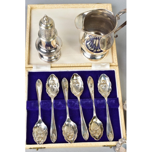 79 - A GROUP OF 20TH CENTURY SILVER, comprising an oval sauceboat, gadrooned rim, S scroll handle, on thr... 