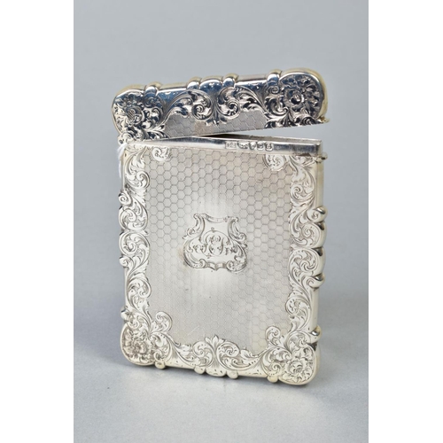 94 - A MID VICTORIAN SILVER CARD CASE OF WAVY RECTANGULAR OUTLINE, foliate engraved and engine turned car... 