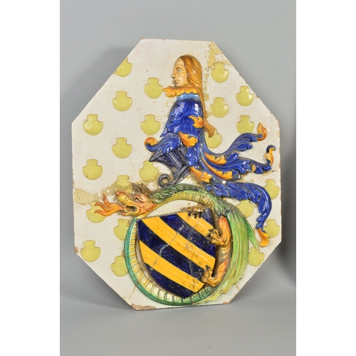 250 - A 19TH CENTURY LARGE FAIENCE ARMORIAL WALL PLAQUE, of shaped octagonal form, decorated in relief, da... 