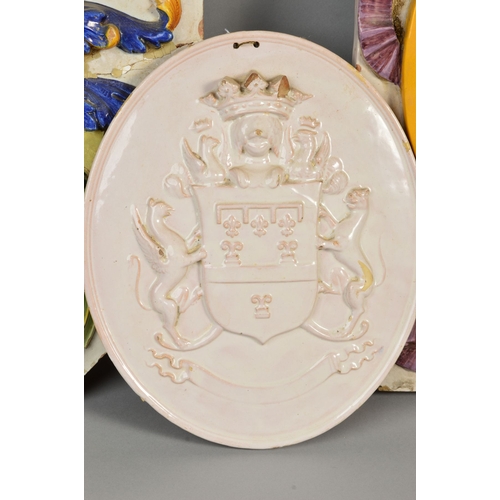 250 - A 19TH CENTURY LARGE FAIENCE ARMORIAL WALL PLAQUE, of shaped octagonal form, decorated in relief, da... 