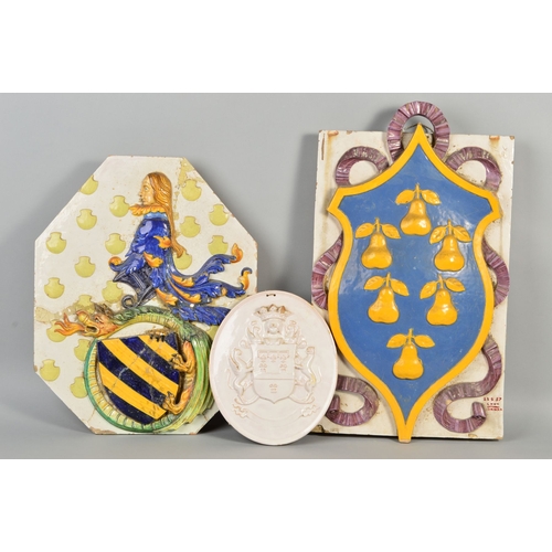 250 - A 19TH CENTURY LARGE FAIENCE ARMORIAL WALL PLAQUE, of shaped octagonal form, decorated in relief, da... 