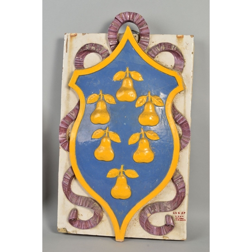 250 - A 19TH CENTURY LARGE FAIENCE ARMORIAL WALL PLAQUE, of shaped octagonal form, decorated in relief, da... 