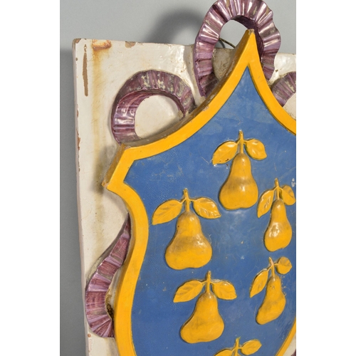 250 - A 19TH CENTURY LARGE FAIENCE ARMORIAL WALL PLAQUE, of shaped octagonal form, decorated in relief, da... 