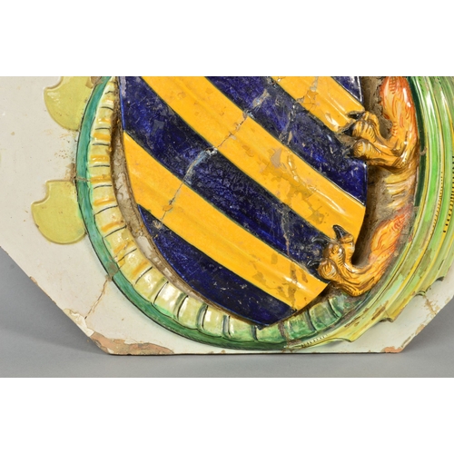 250 - A 19TH CENTURY LARGE FAIENCE ARMORIAL WALL PLAQUE, of shaped octagonal form, decorated in relief, da... 