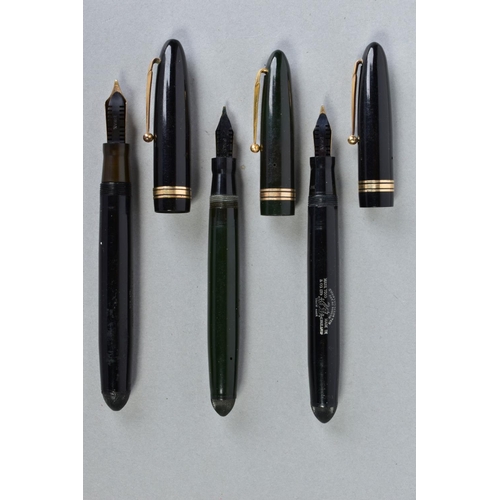 1 - THREE VINTAGE SWAN LEVERLESS FOUNTAIN PENS including a 2060 in black and gold with a 14ct 6 nib, a 1... 