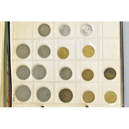 100 - A BISCUIT TIN OF COINS to include two small albums of world coins, some with silver content etc