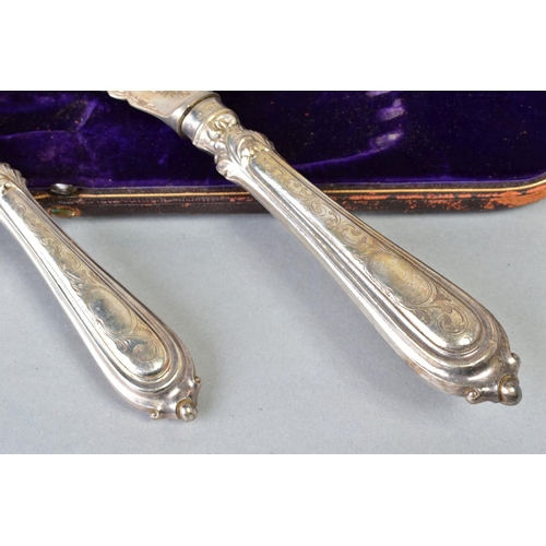 102 - A CASED SET OF VICTORIAN SILVER FISH SERVERS, foliate engraved decoration, makers Harrison Brothers ... 