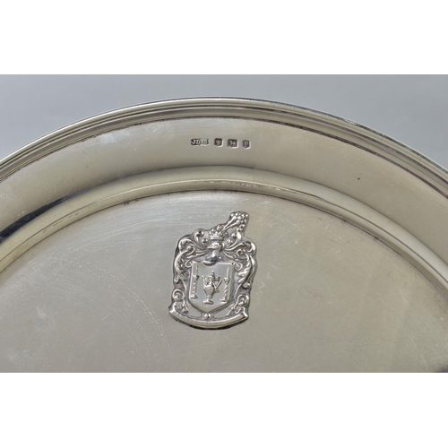 103 - A GEORGE V SILVER CIRCULAR TRAY, bears applied crest style motif, makers James Dixon & Sons Ltd, She... 