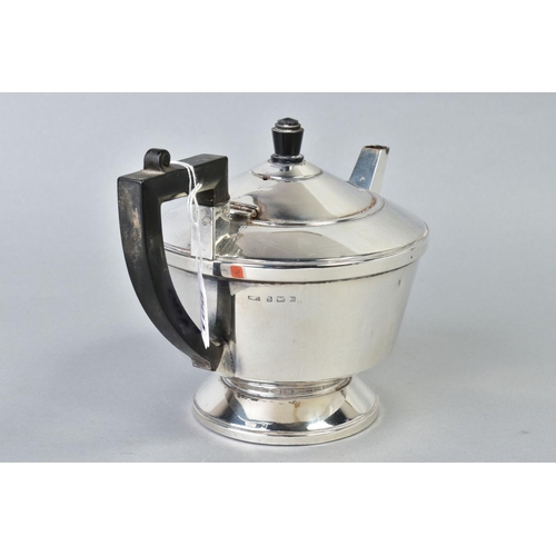 106 - A GEORGE VI SILVER CIRCULAR TEAPOT, black bakelite fitments, makers A.L. Davenport Ltd, Birmingham 1... 