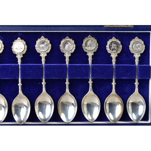 126 - A CASED SET OF ELIZABETH II SILVER LIMITED EDITION 'THE TWELVE ZODIAC SPOONS' sculpted by David Corn... 