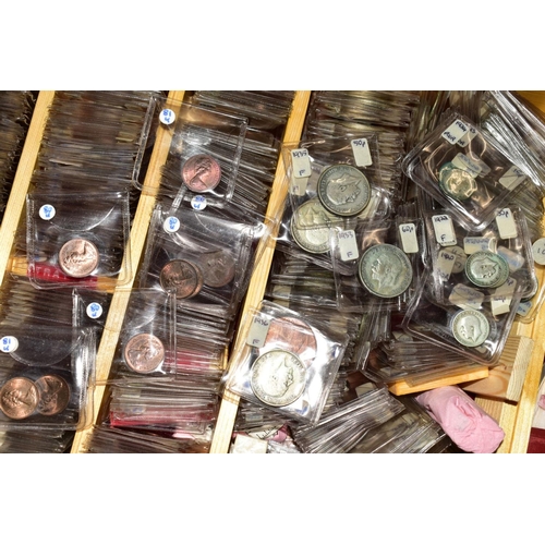 128 - A LARGE COLLECTION OF COINS AND COMMEMORATIVES to include four purpose made coin cases, 24'' x 18'' ... 