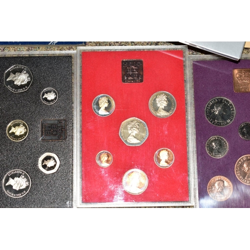 129 - A LARGE BOX AND TUB OF COINS AND COMMEMORATIVES to include fourteen proof United Kingdom year sets w... 