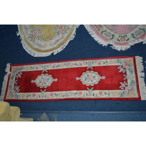 1290 - A COLLECTION OF G H FIRTH FOUR WOOLLEN RUGS to include two large oval in pink and yellow, 250cm x 16... 