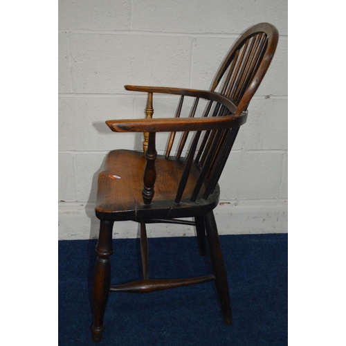 1292 - AN EARLY 19TH CENTURY ELM HOOP BACK WINDSOR ARMCHAIR, spindle back and arms on turned legs united by... 