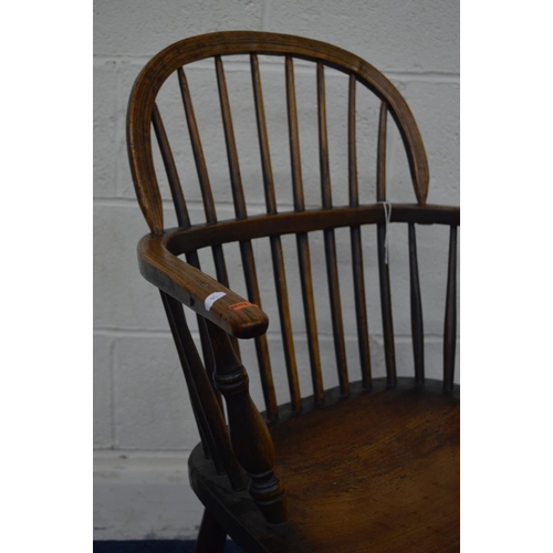 1292 - AN EARLY 19TH CENTURY ELM HOOP BACK WINDSOR ARMCHAIR, spindle back and arms on turned legs united by... 