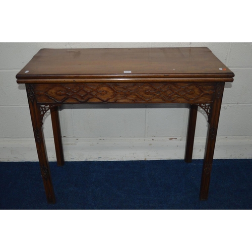 1293 - A GEORGE III MAHOGANY FOLD OVER CARD TABLE, green baize interior above a frieze and front legs with ... 