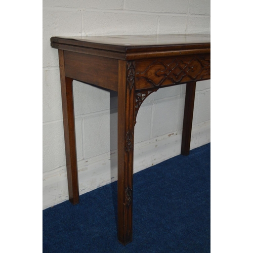 1293 - A GEORGE III MAHOGANY FOLD OVER CARD TABLE, green baize interior above a frieze and front legs with ... 