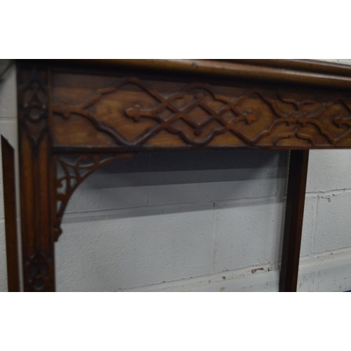 1293 - A GEORGE III MAHOGANY FOLD OVER CARD TABLE, green baize interior above a frieze and front legs with ... 