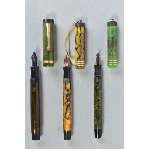 34 - THREE VINTAGE PARKER DUOFOLD FOUNTAIN PENS consisting of a Duofold Junior in marbled green, a lighte... 