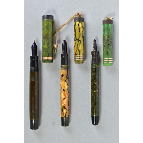 34 - THREE VINTAGE PARKER DUOFOLD FOUNTAIN PENS consisting of a Duofold Junior in marbled green, a lighte... 