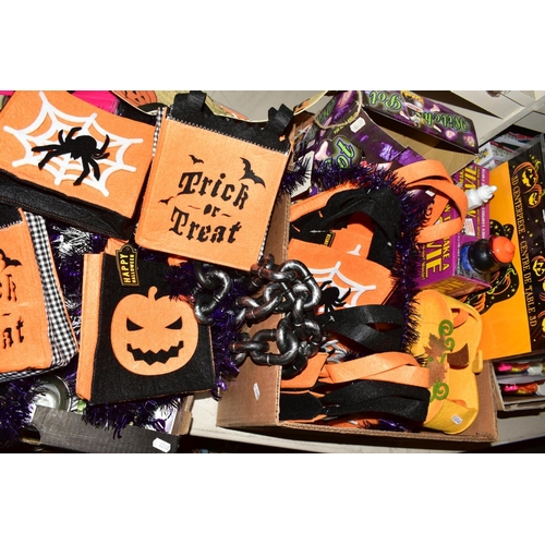 357 - TWO BOXES OF HALLOWEEN THEMED ITEMS, including tinsel, face paint, candleholders, napkins, invitatio... 