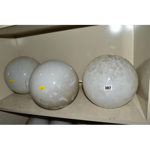 387 - A SET OF FOUR OPAQUE WHITE GLASS SPHERICAL CEILING LIGHT SHADES WITH OVERPAINTED NICKEL PLATED FITTI... 