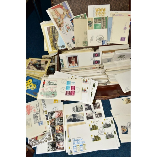 410 - A LARGE COLLECTION OF FIRST DAY COVERS AND COMMERCIAL COVERS in three suitcases and a box, together ... 