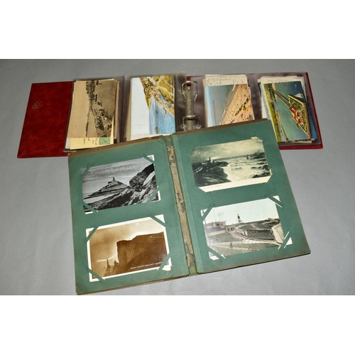 417 - TWO ALBUMS OF POSTCARDS, the first album contains sixty eight postcards of British Piers and the sec... 