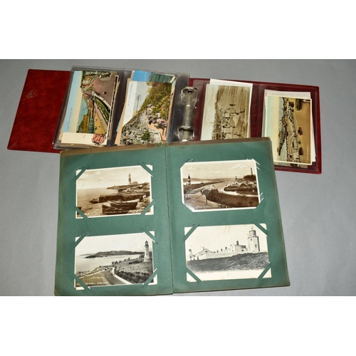 417 - TWO ALBUMS OF POSTCARDS, the first album contains sixty eight postcards of British Piers and the sec... 