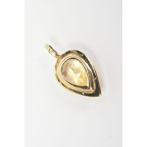 53 - A 9CT GOLD PENDANT, designed with a pear cut citrine within a raised three claw setting and diamond ... 