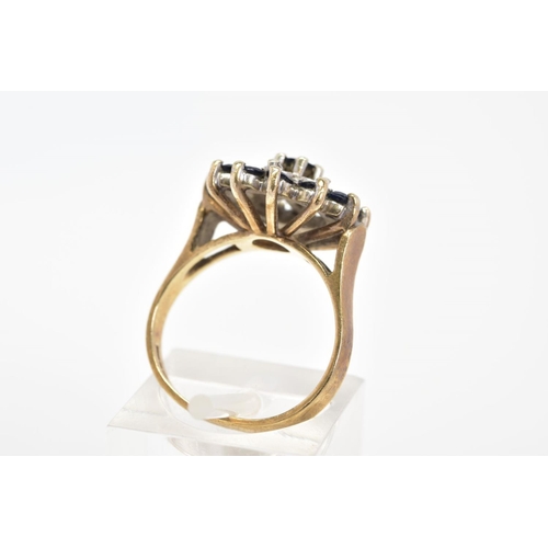 58 - A 9CT GOLD SAPPHIRE AND DIAMOND RING, of cluster design set with thirteen circular cut sapphires and... 