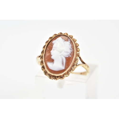 60 - A 9CT GOLD CAMEO RING, of oval design depicting a lady in profile, within a rope twist surround, to ... 