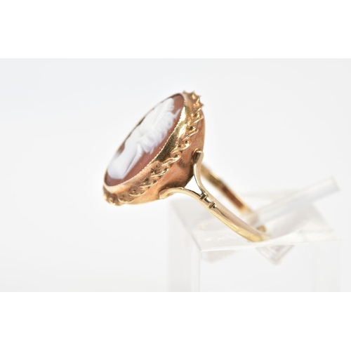 60 - A 9CT GOLD CAMEO RING, of oval design depicting a lady in profile, within a rope twist surround, to ... 