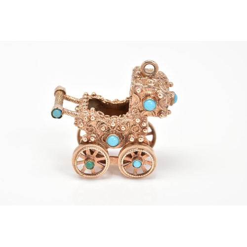 62 - A 9CT GOLD CHARM, designed as a vintage pram set with turquoise stones, with rotating wheels, with 9... 