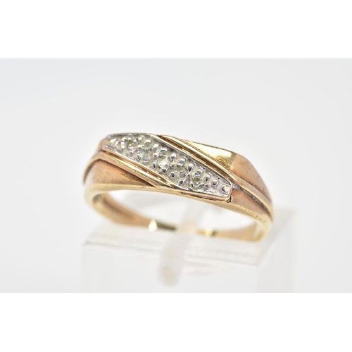 64 - A 9CT GOLD RING, designed as a diagonal line of three single cut diamonds in pave settings to the ta... 