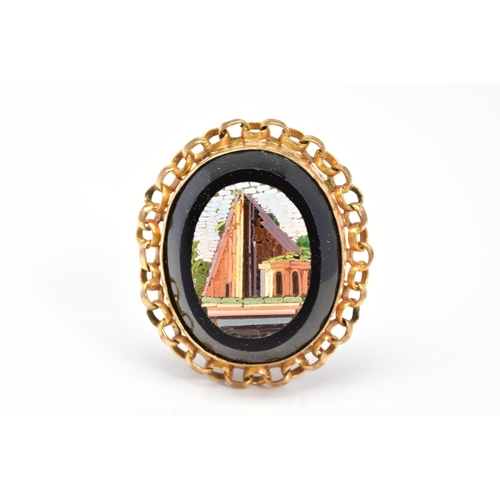 67 - A MICRO MOSAIC PENDANT, the oval panel depicting a building, with curb link surround, length 32mm