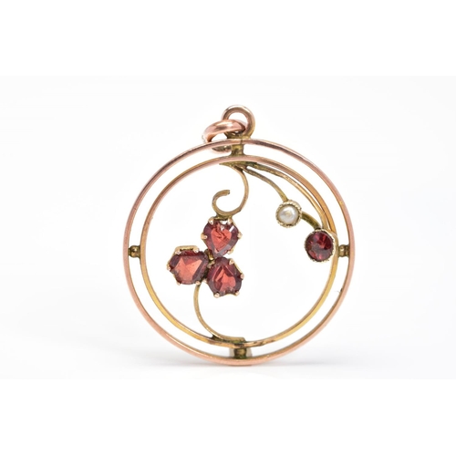 71 - AN EARLY 20TH CENTURY GARNET AND SPLIT PEARL PENDANT, of circular open work design featuring garnet ... 