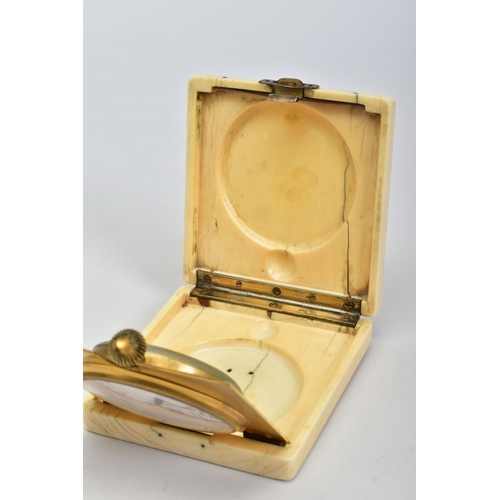 75 - AN EARLY 20TH CENTURY IVORY CASED TRAVEL CLOCK, of square design with applied silver monogram to lid... 