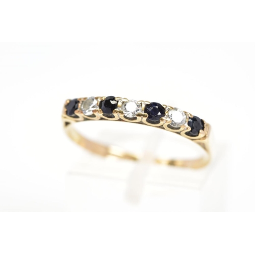 87 - A 9CT GOLD SAPPHIRE AND CUBIC ZIRCONIA RING, designed as a line of four circular sapphires interspac... 