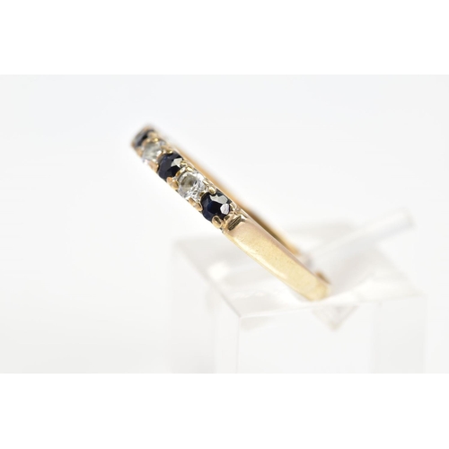 87 - A 9CT GOLD SAPPHIRE AND CUBIC ZIRCONIA RING, designed as a line of four circular sapphires interspac... 