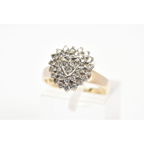 89 - A 9CT GOLD HEART SHAPE DIAMOND CLUSTER RING, designed as a three tiered cluster in a heart shape out... 