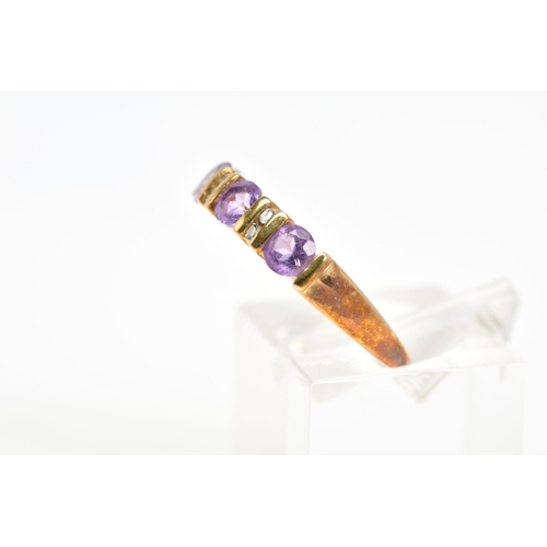 90 - AN AMETHYST AND DIAMOND RING, designed as a line of four circular amethysts with bar spacers set wit... 